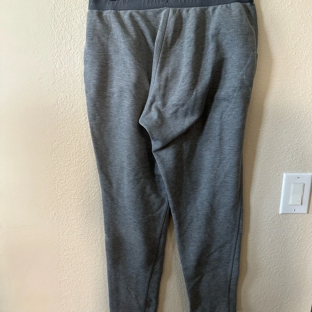 Nike women's Dark Gray Athletic Joggers with Black Waistband size L/ NWOT B187